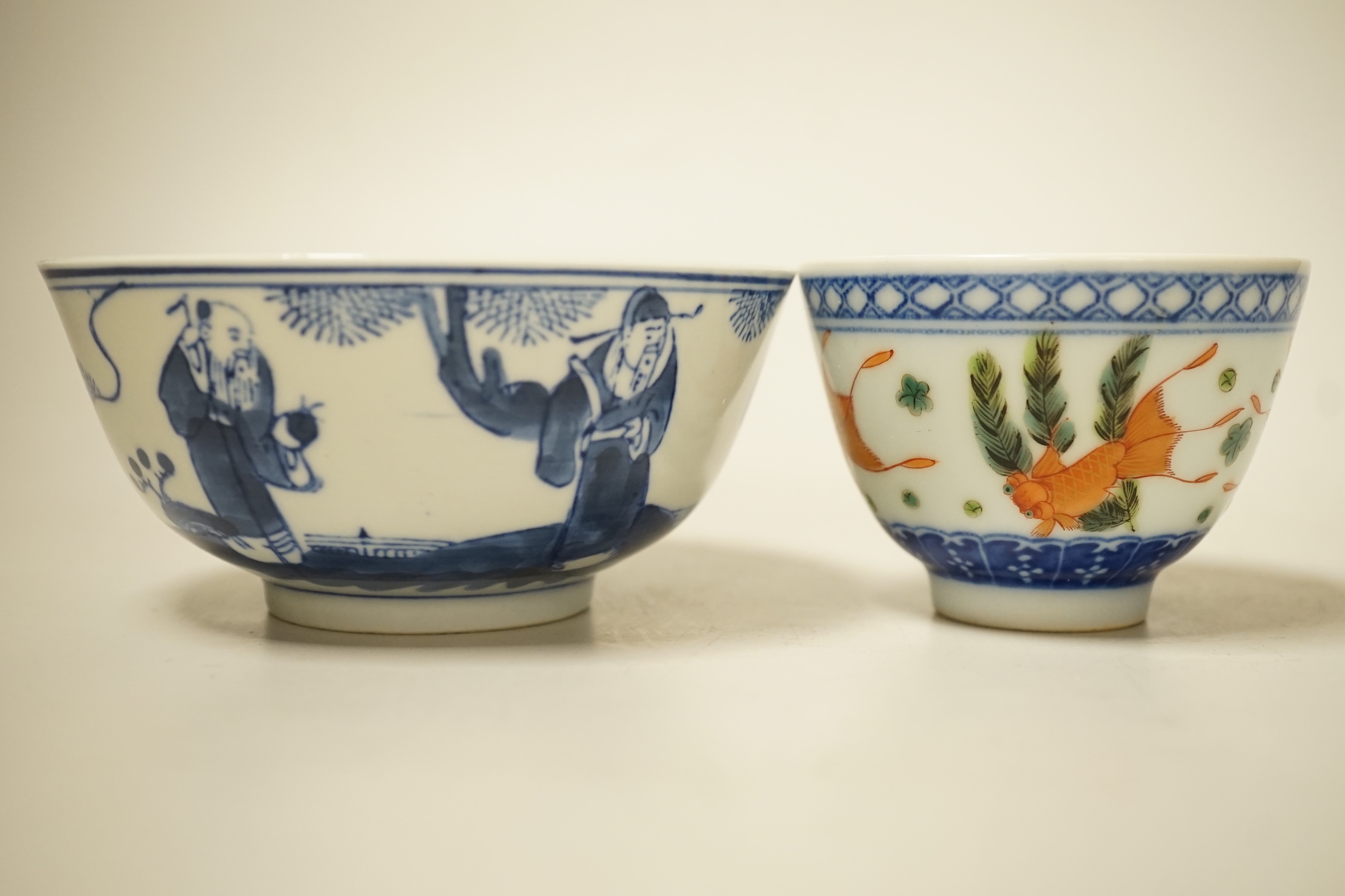 A 19th century Chinese blue and white bowl, an enamelled goldfish cup and two snuff bottles